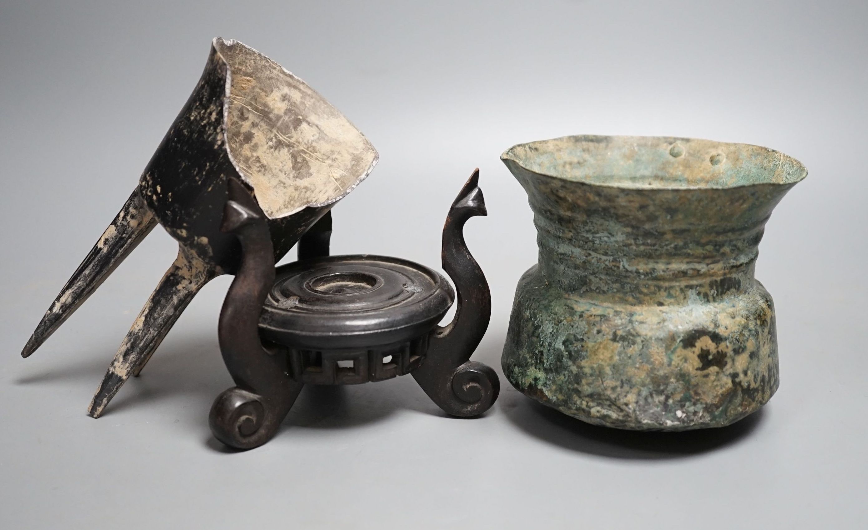 A Han dynasty pottery tripod vessel and a Roman jug
